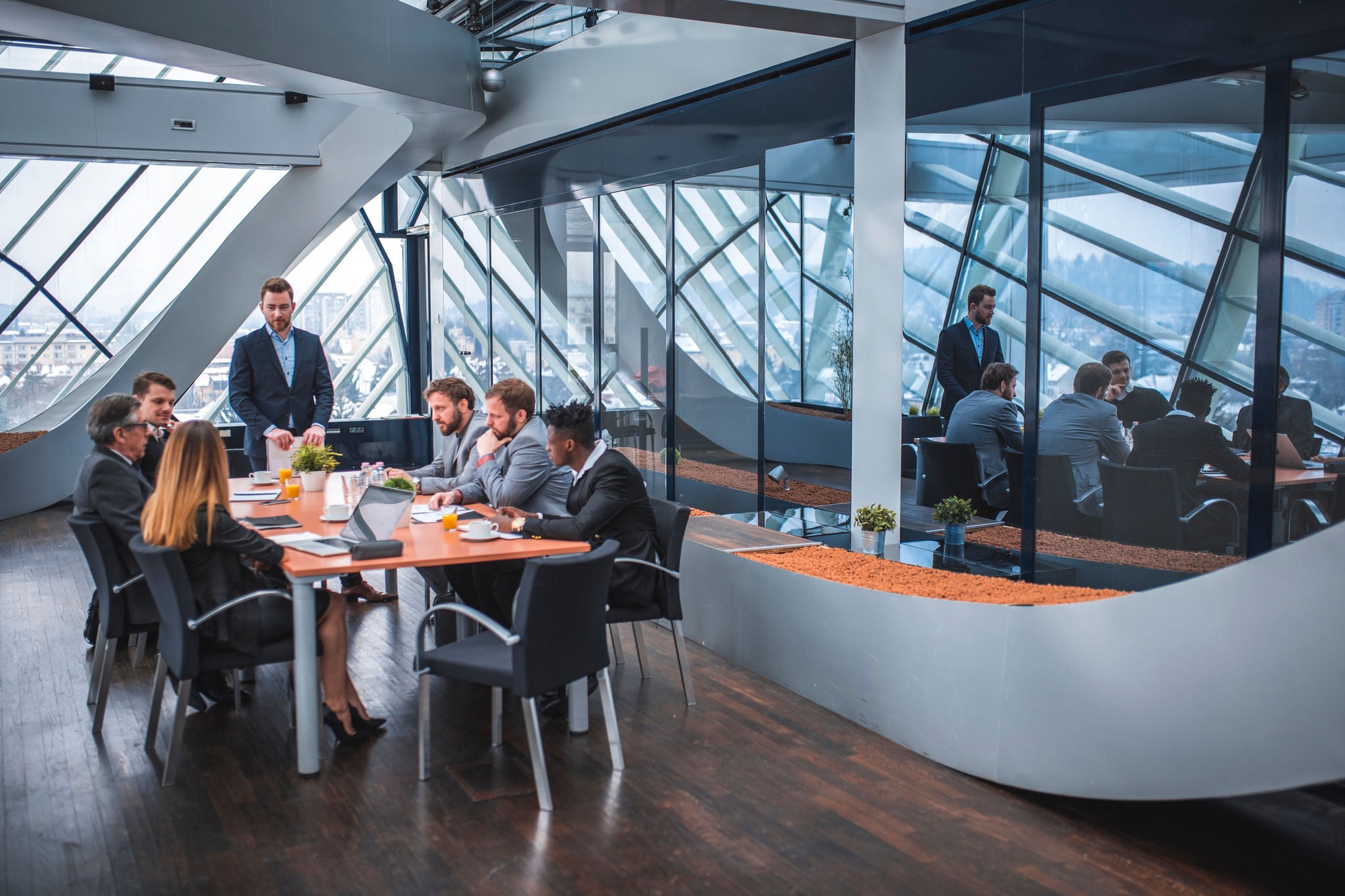 Business team having a meeting in an office in Ljubljana, Slovenia. Businessman is having a presentation.