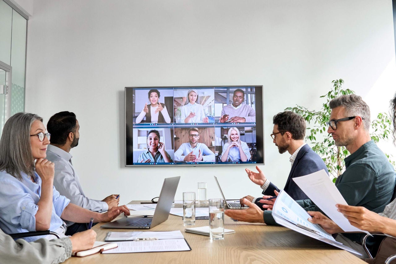 Employees having an online business conference