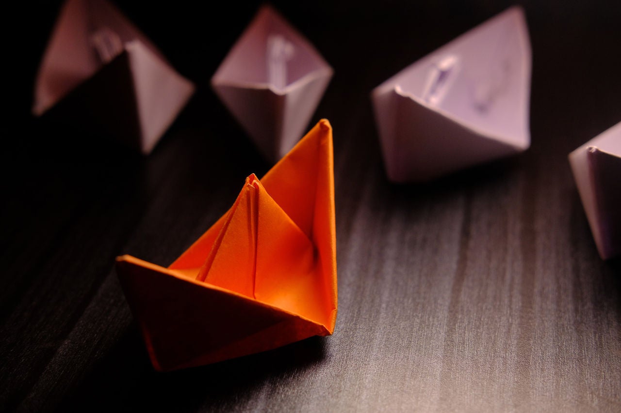 paper boat business leadership concept