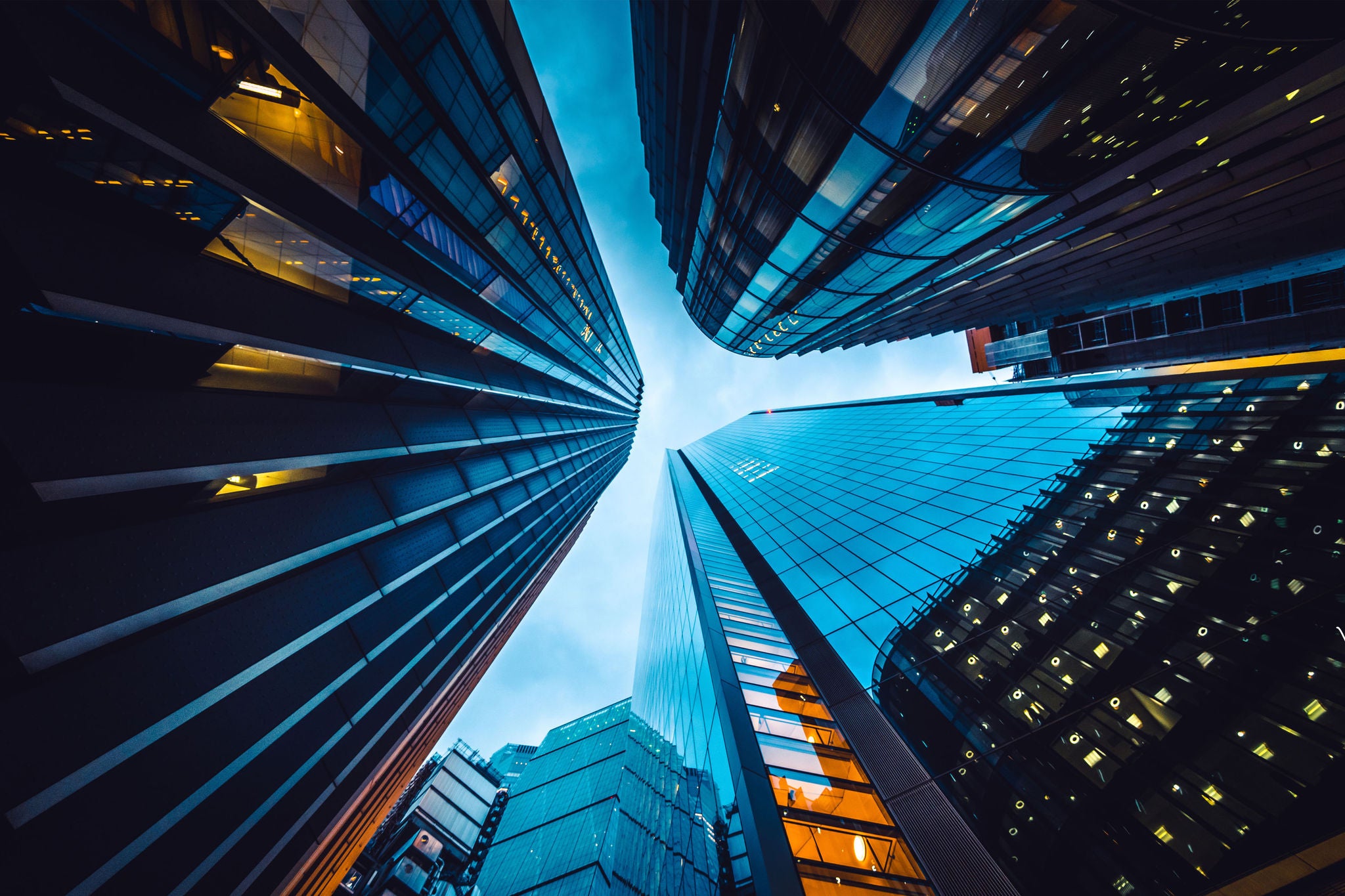 Looking directly up at the skyline of the financial district in central London
